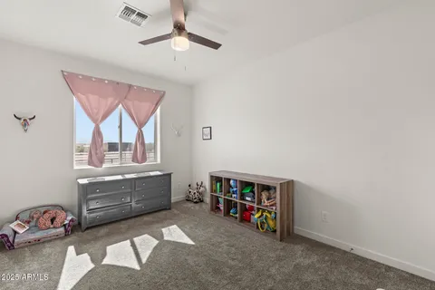 a view of a livingroom with wooden floor and cabinet