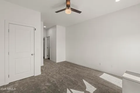 a bedroom with a bed and a painting