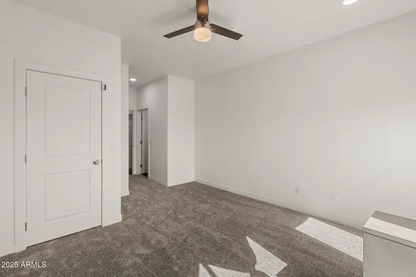 a bedroom with a bed and a painting