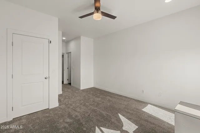 a bedroom with a bed and a painting