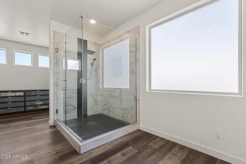 a spacious bathroom with double vanity sink and a mirror