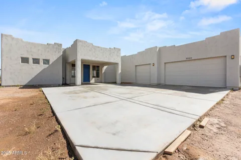 a view of a backyard of the house