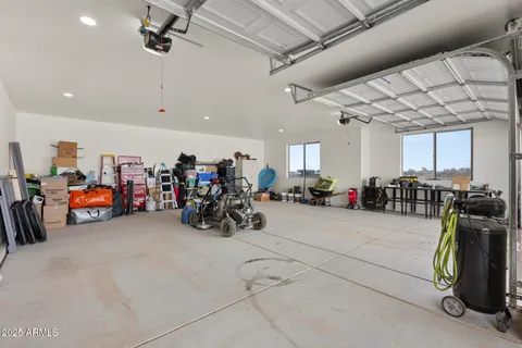 a view of a garage with a bike and car