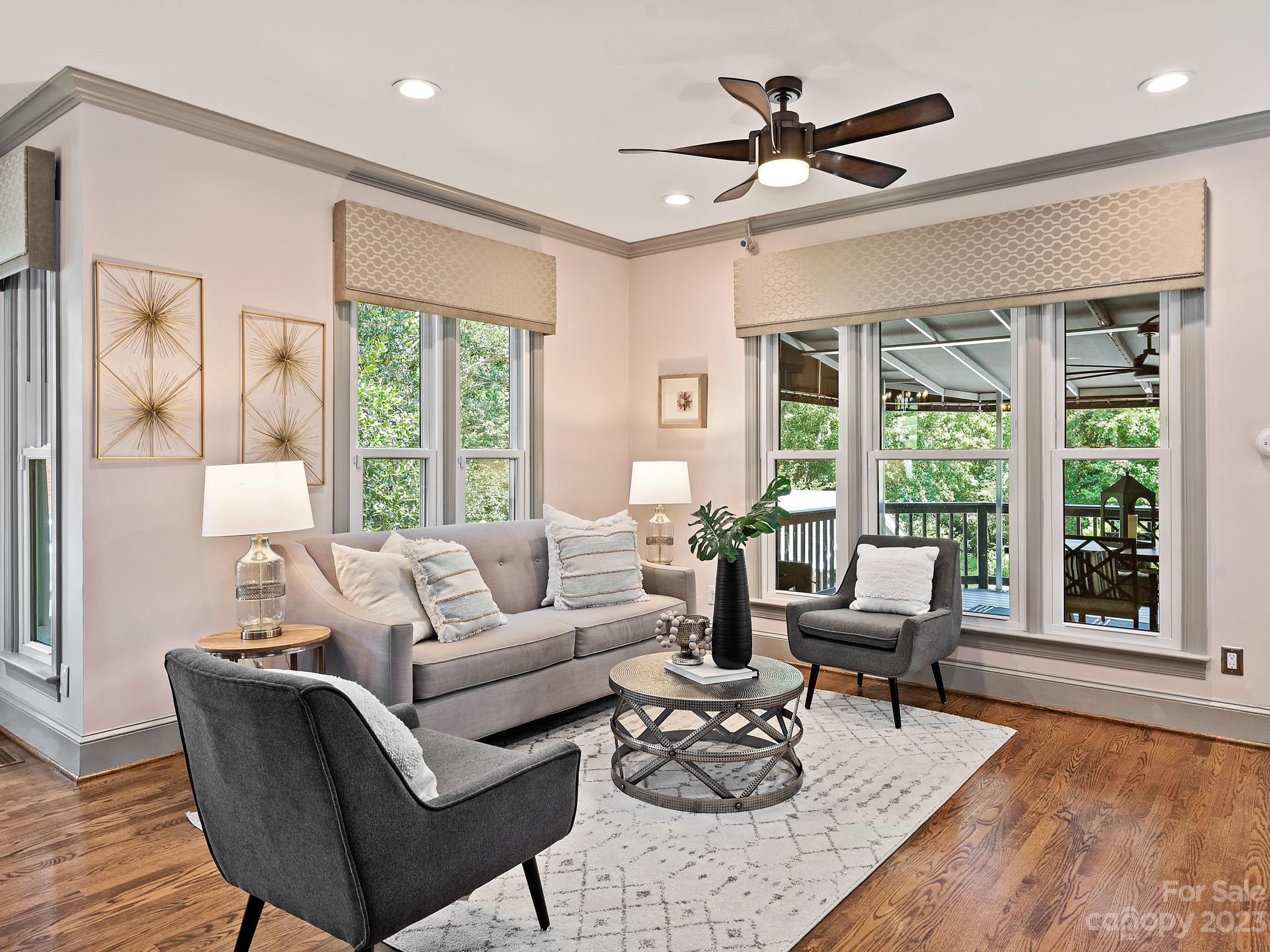 684 Beacon Knoll Lane Fort Mill, SC 29708 - Photo 15 of 46 a living room with furniture and large windows