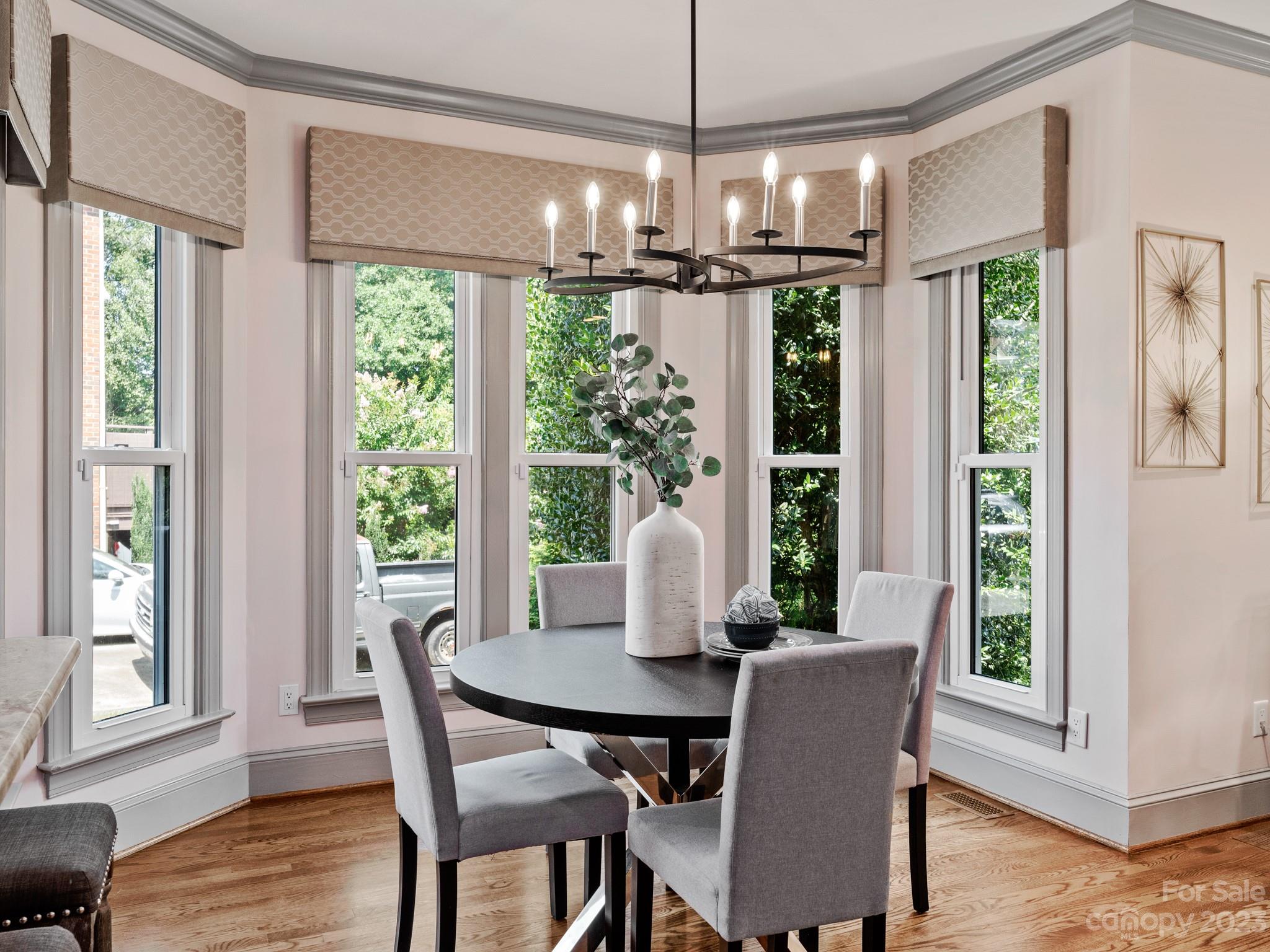 684 Beacon Knoll Lane Fort Mill, SC 29708 - Photo 18 of 46 a view of a dining room with furniture window and wooden floor
