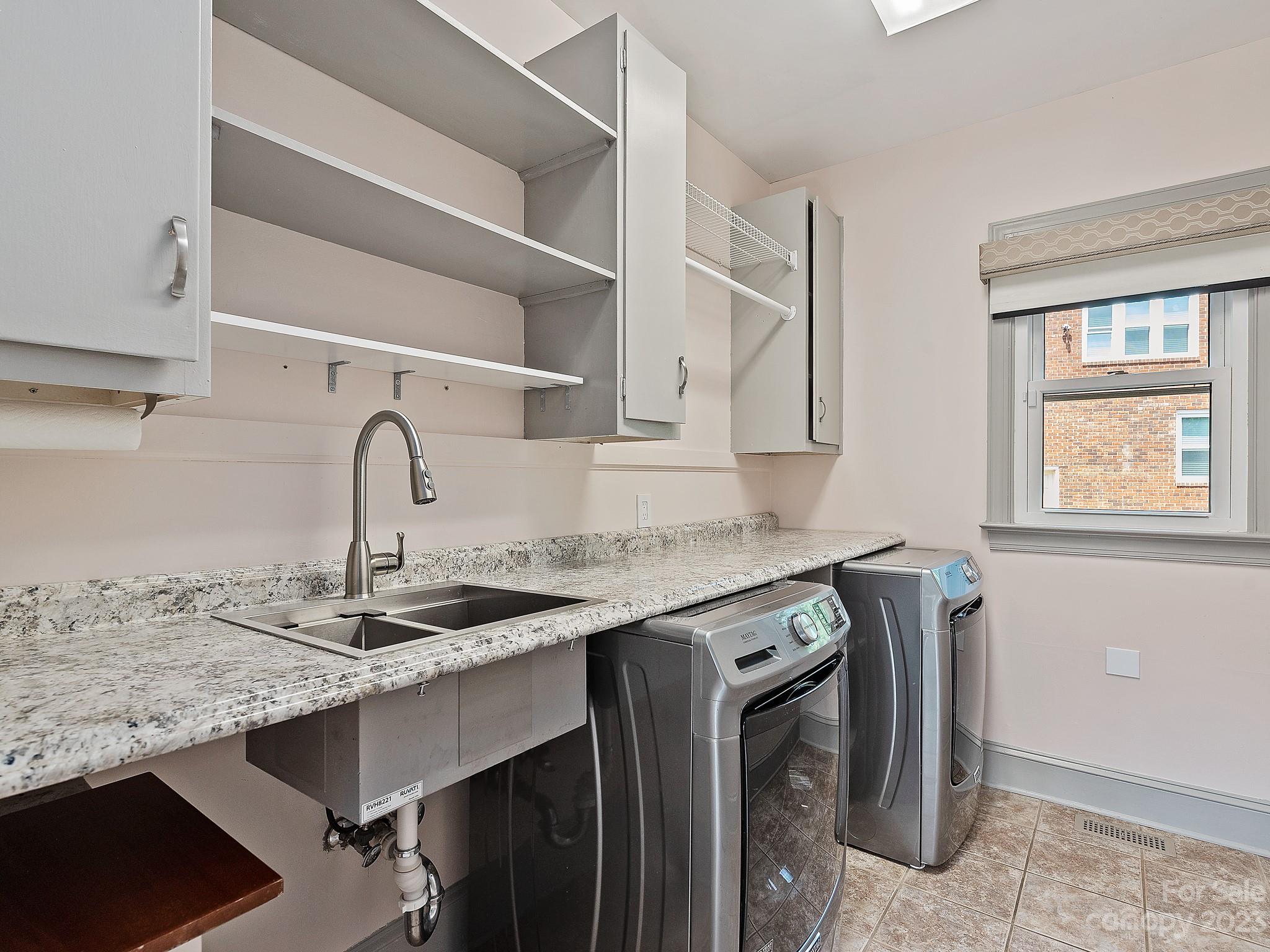 684 Beacon Knoll Lane Fort Mill, SC 29708 - Photo 21 of 46 a kitchen with a sink a stove and cabinets