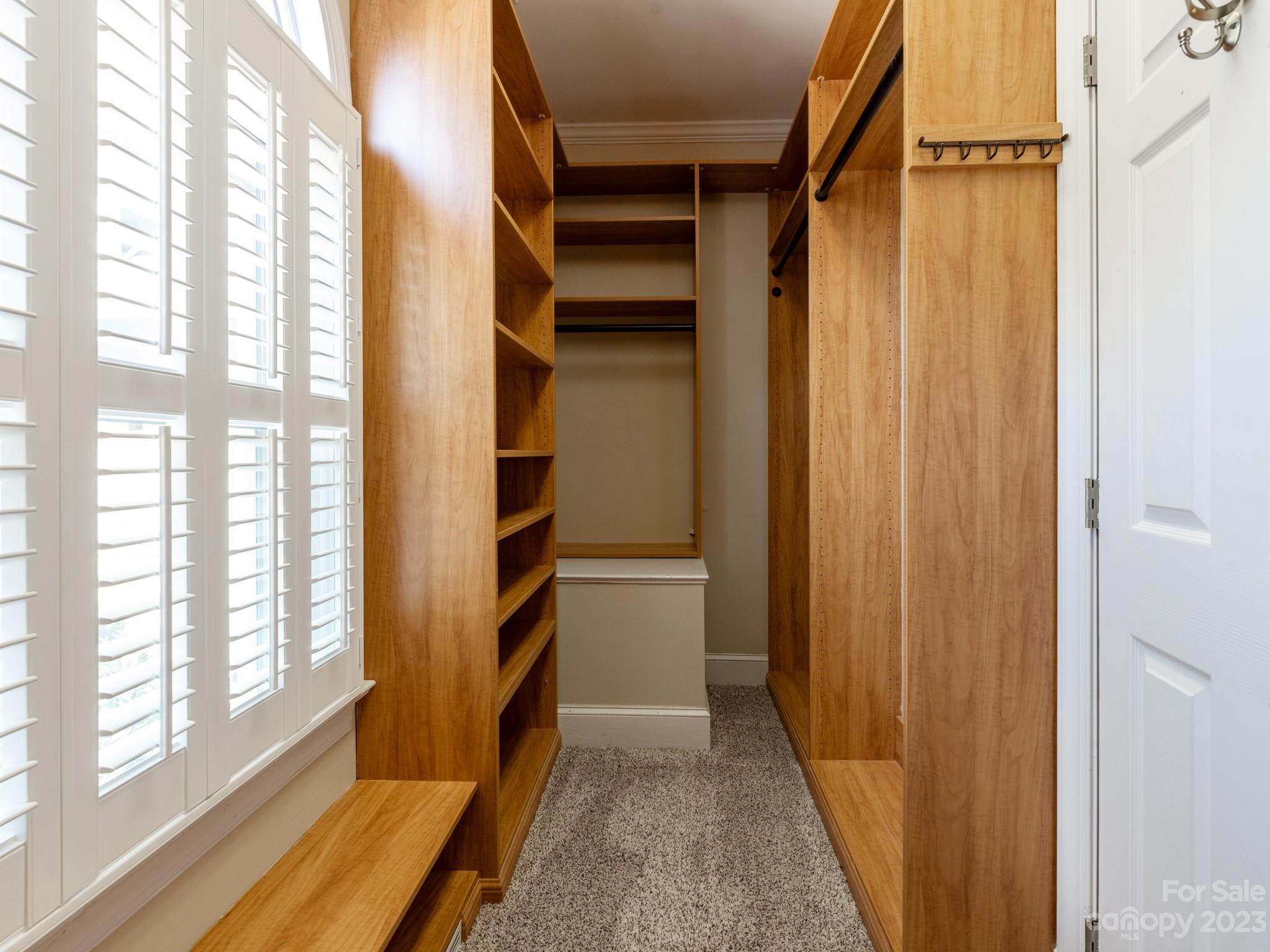 684 Beacon Knoll Lane Fort Mill, SC 29708 - Photo 27 of 46 a view of walk in closet with empty racks