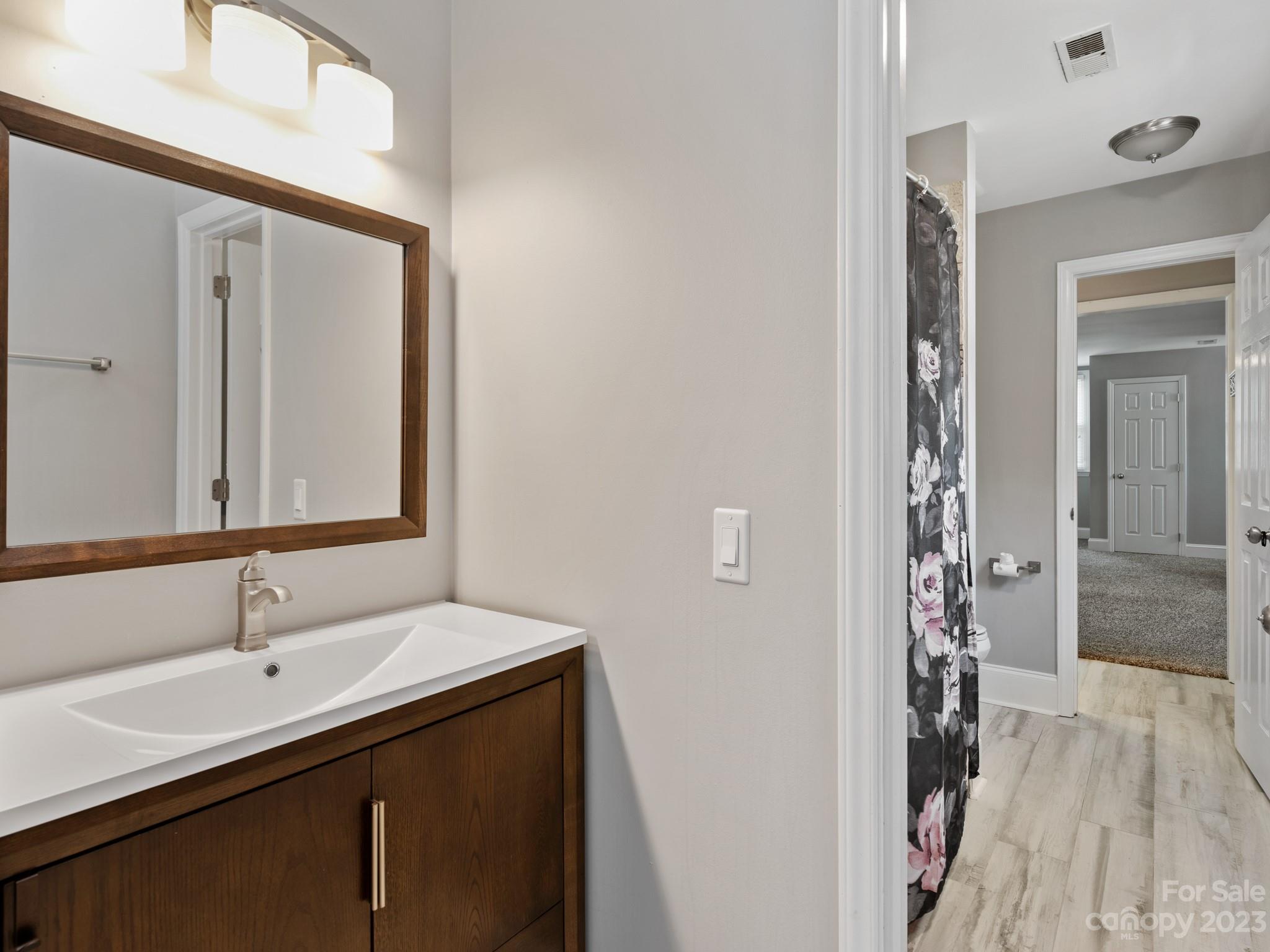 684 Beacon Knoll Lane Fort Mill, SC 29708 - Photo 30 of 46 a bathroom with a double vanity sink and mirror