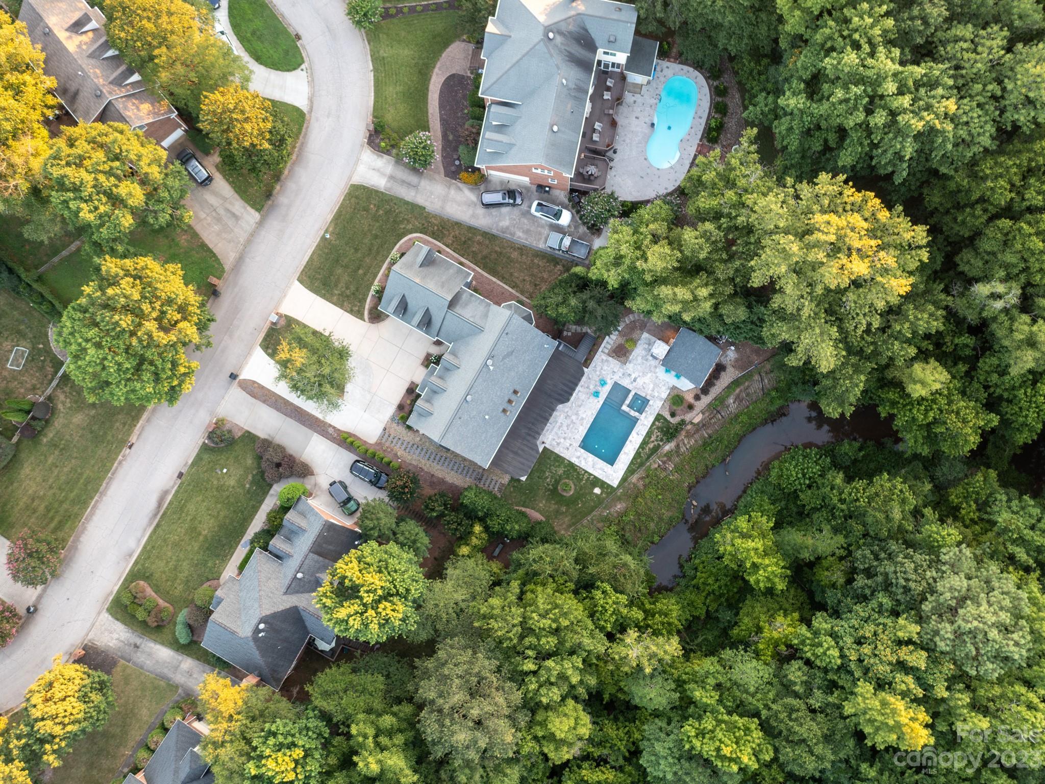 684 Beacon Knoll Lane Fort Mill, SC 29708 - Photo 3 of 46 an aerial view of a house with a yard and a fountain