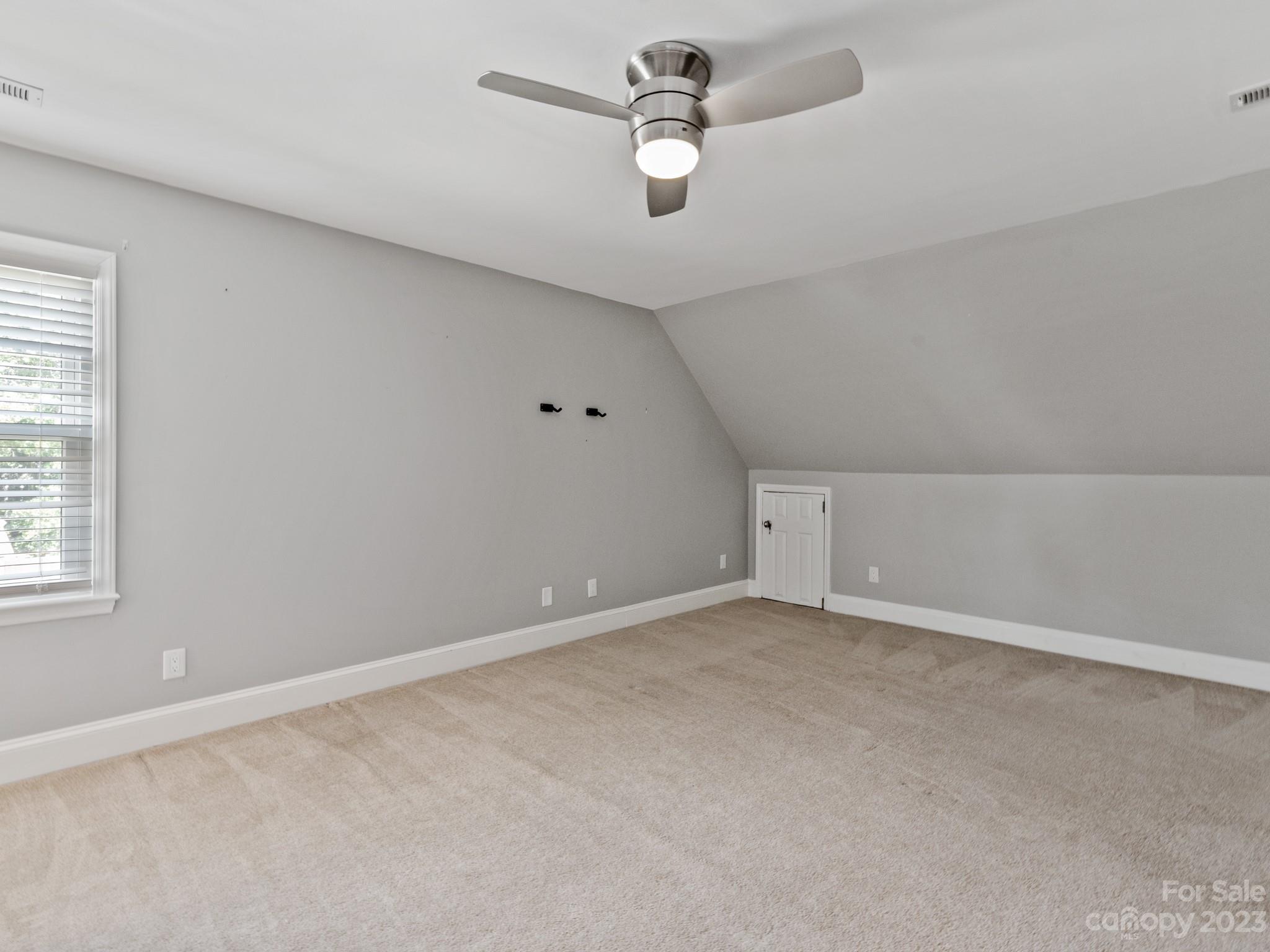 684 Beacon Knoll Lane Fort Mill, SC 29708 - Photo 31 of 46 an empty room with a empty space and a ceiling fan