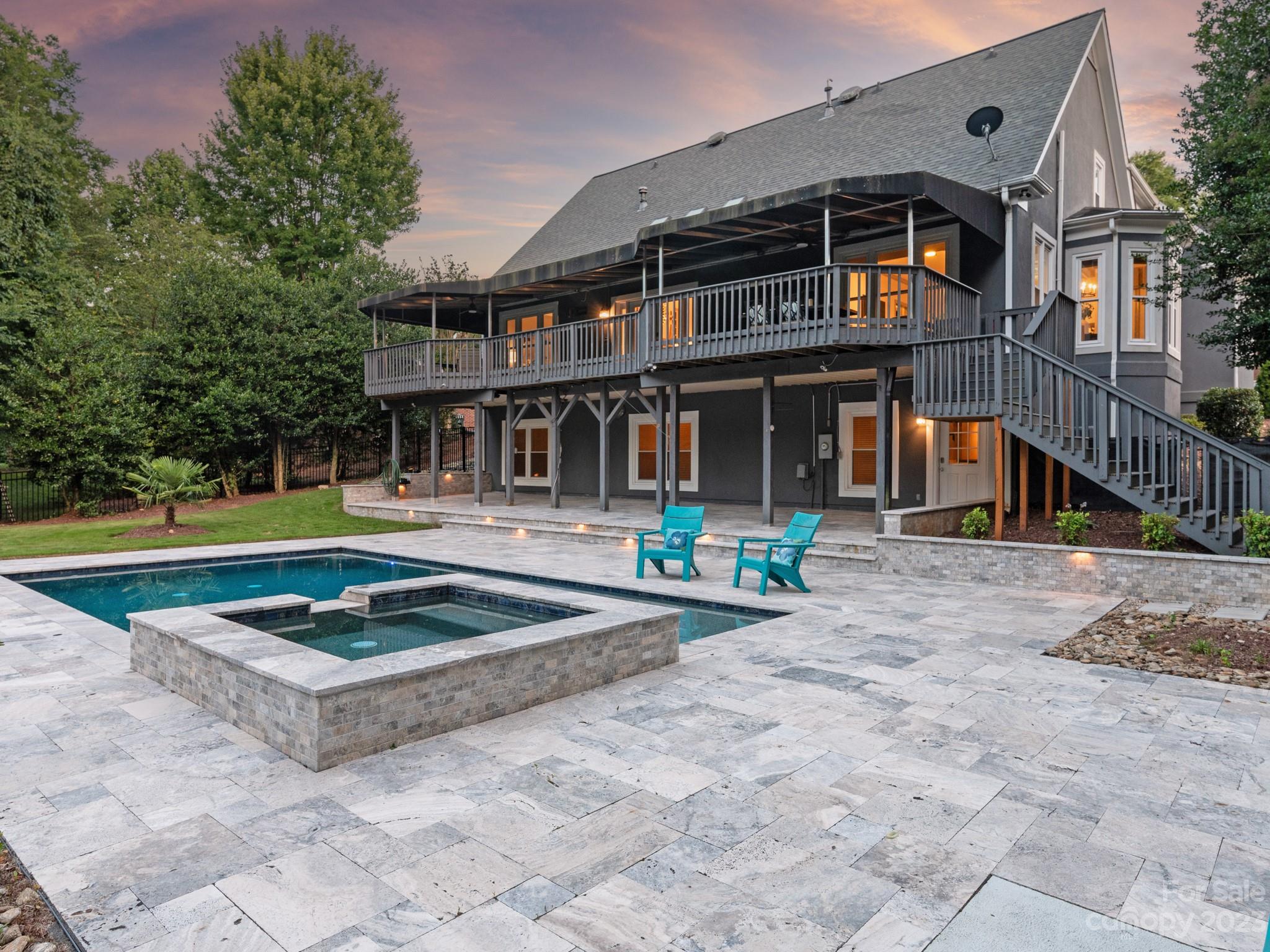 684 Beacon Knoll Lane Fort Mill, SC 29708 - Photo 7 of 46 a front view of a house with swimming pool and porch
