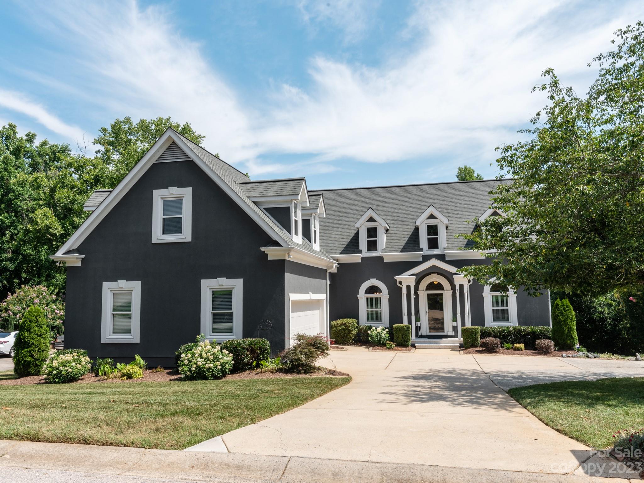 684 Beacon Knoll Lane Fort Mill, SC 29708 - Photo 9 of 46 a front view of a house with a yard