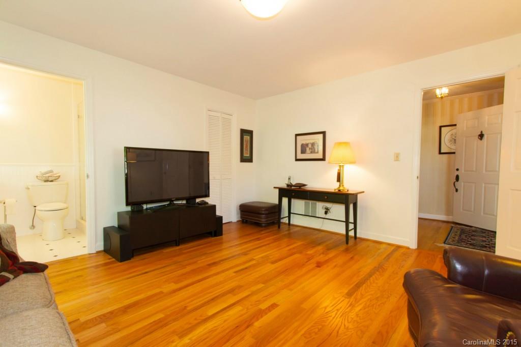 211 Kimberly Road Davidson, NC 28036 - Photo 14 of 24 a bedroom with a bed and a flat screen tv