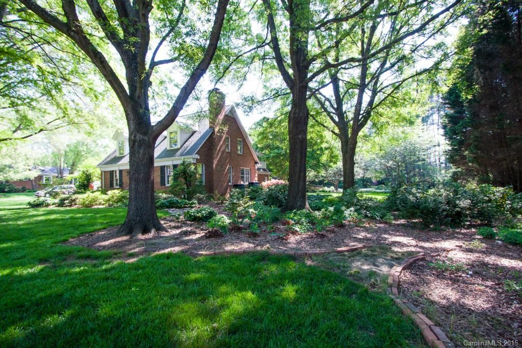 211 Kimberly Road Davidson, NC 28036 - Photo 3 of 24 a view of a backyard with large trees