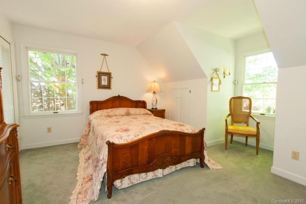 211 Kimberly Road Davidson, NC 28036 - Photo 22 of 24 a bedroom with a bed chair and window