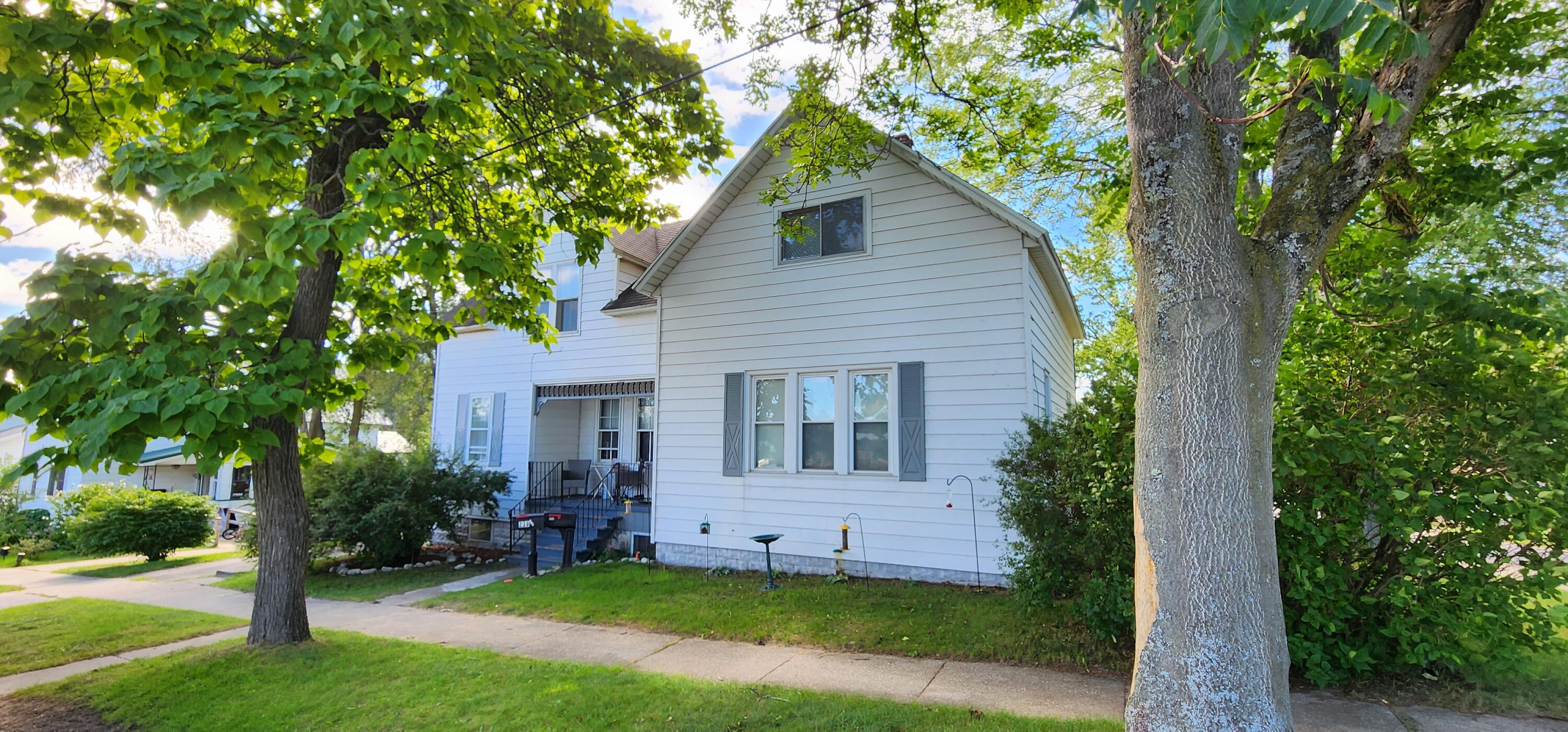 239 10th Street, Unit 2 Manistee, MI 49660 - Photo 23 of 27 Exterior sunny 20230830_110804