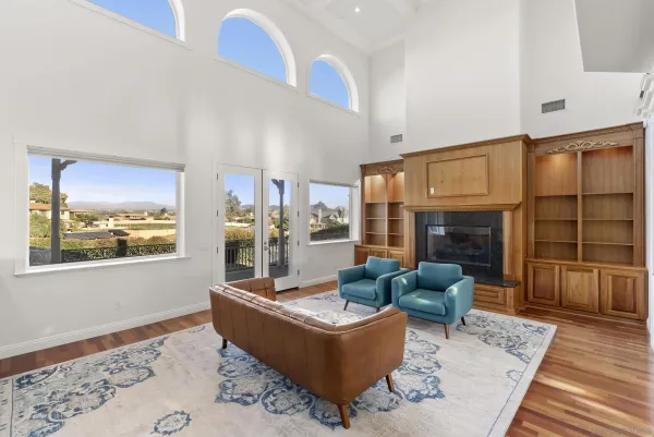 a view of an empty room with a fireplace