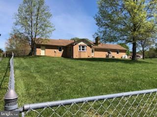 181 Grove Farm Road Front Royal, VA 22630 - Photo 12 of 35 a front view of a house with a garden
