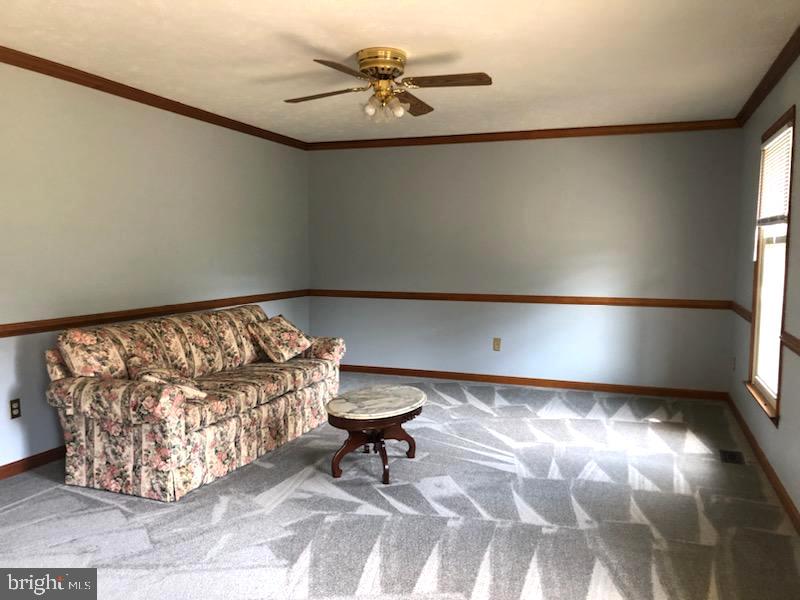 181 Grove Farm Road Front Royal, VA 22630 - Photo 15 of 35 a living room with a couch