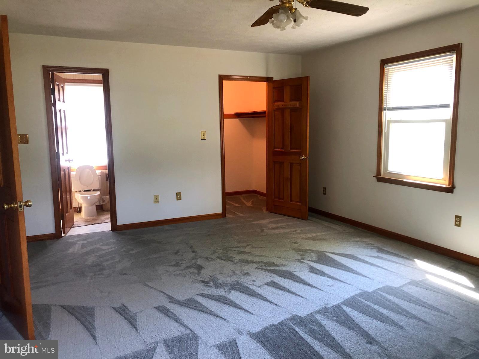 181 Grove Farm Road Front Royal, VA 22630 - Photo 28 of 35 an empty room with windows and closet