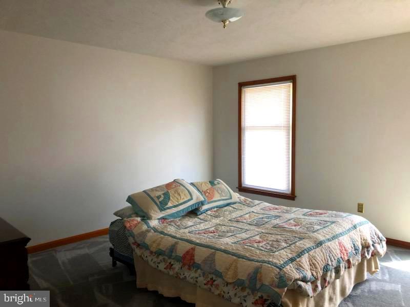 181 Grove Farm Road Front Royal, VA 22630 - Photo 29 of 35 a bedroom with a bed and window