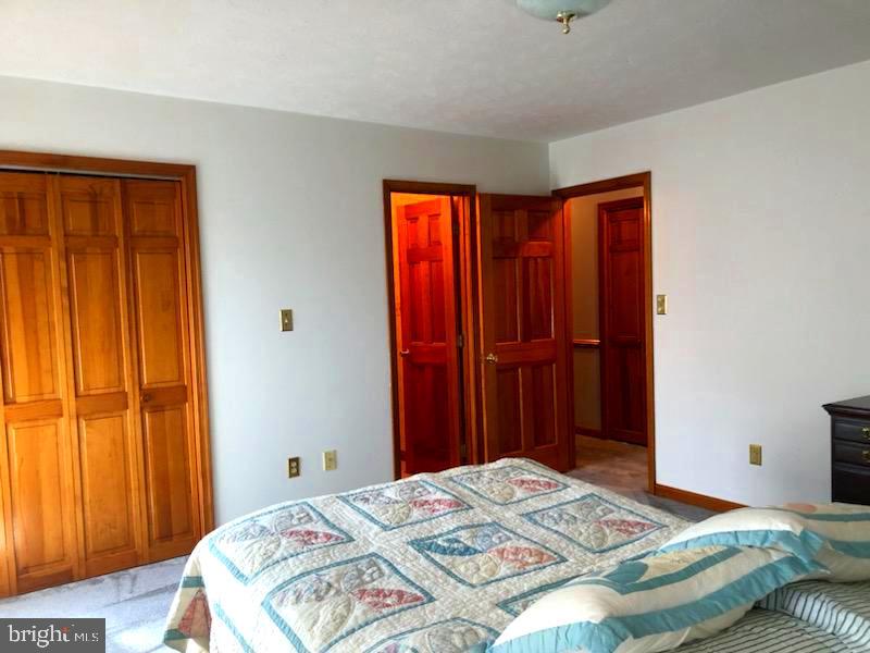 181 Grove Farm Road Front Royal, VA 22630 - Photo 30 of 35 a bedroom with a bed and a closet
