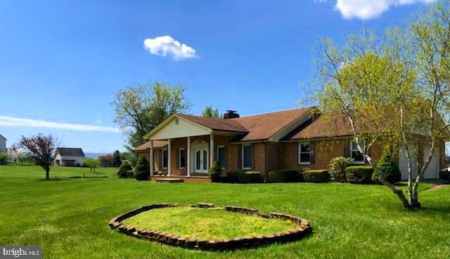 181 Grove Farm Road Front Royal, VA 22630 - Photo 4 of 35 a view of a house with a backyard porch and sitting area