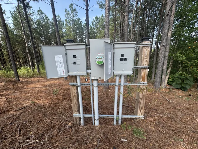 a view of a chairs and table in the backyard