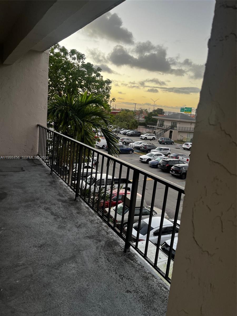 5625 West 20th Avenue, Unit 306 Hialeah, FL 33012 - Photo 2 of 9 a view of a balcony with an outdoor seating