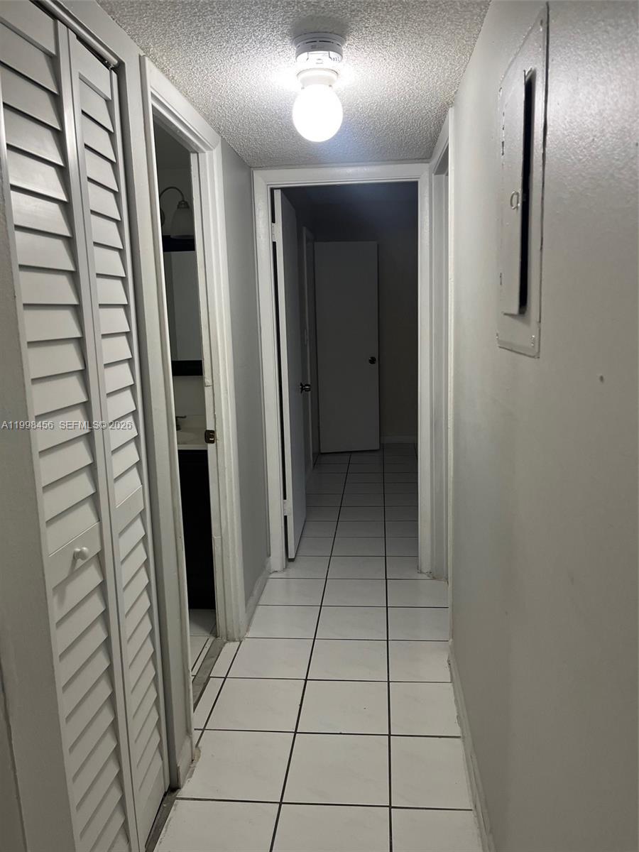 5625 West 20th Avenue, Unit 306 Hialeah, FL 33012 - Photo 5 of 9 a view of a hallway