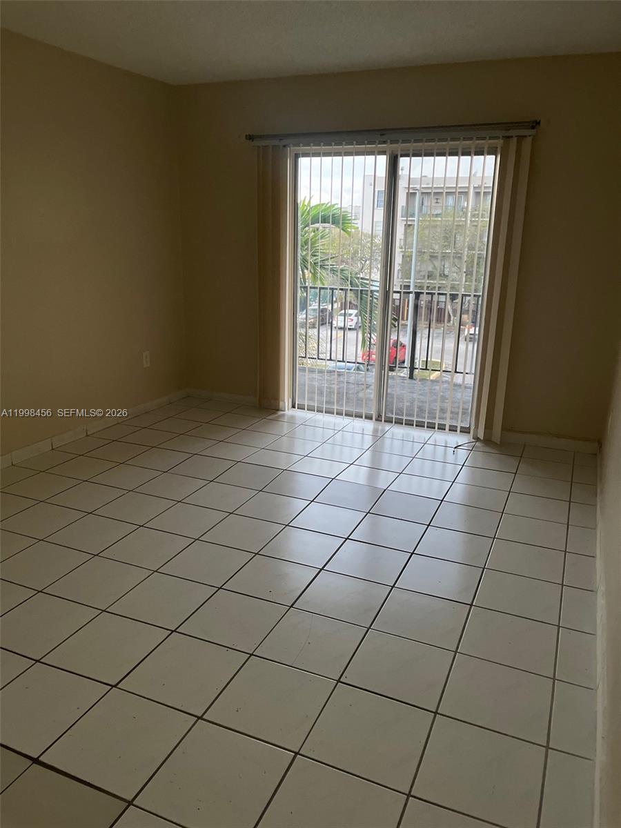 5625 West 20th Avenue, Unit 306 Hialeah, FL 33012 - Photo 6 of 9 a view of a room and window