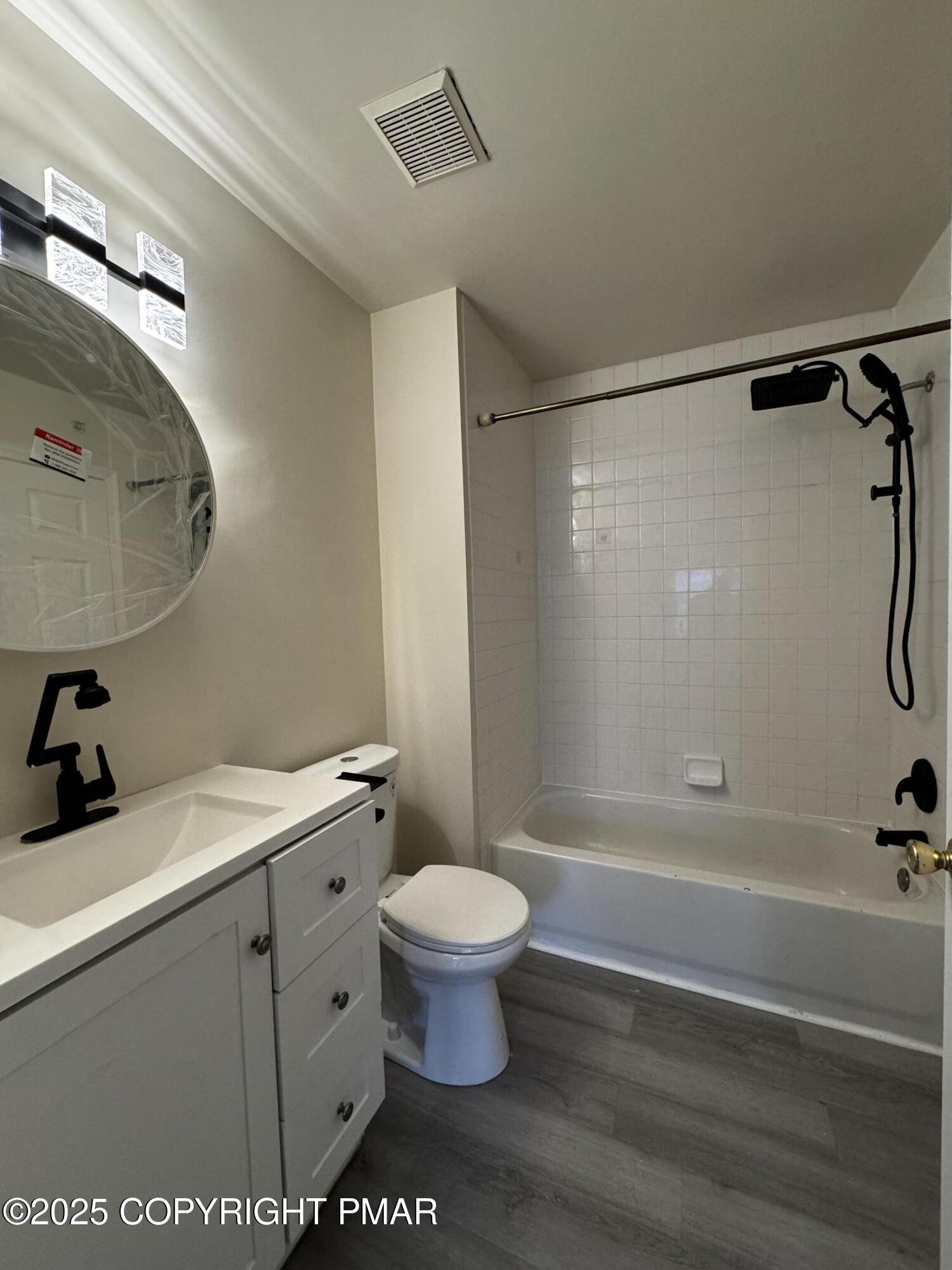 63 Ridgeview Circle, Unit A East Stroudsburg, PA 18302 - Photo 11 of 13 a bathroom with a sink a toilet and a shower