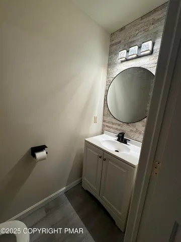 a bathroom with a sink and mirror