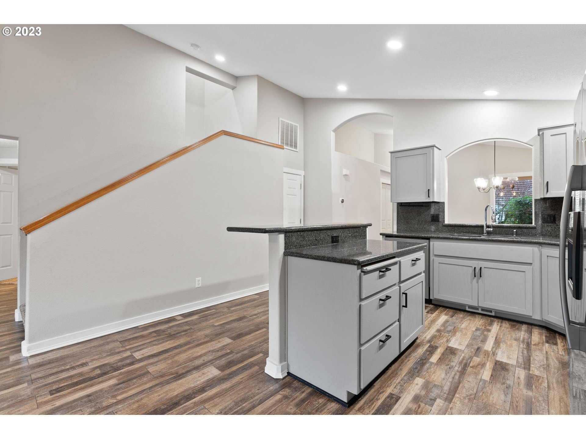 38446 Miller Street Sandy, OR 97055 - Photo 12 of 40 a kitchen with granite countertop white cabinets and white appliances