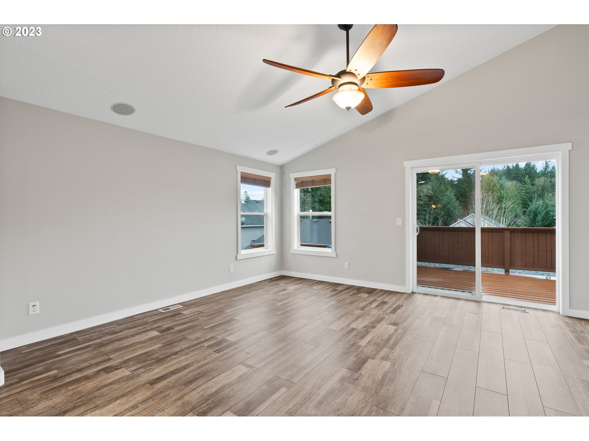 38446 Miller Street Sandy, OR 97055 - Photo 14 of 40 an empty room with wooden floor fan and windows