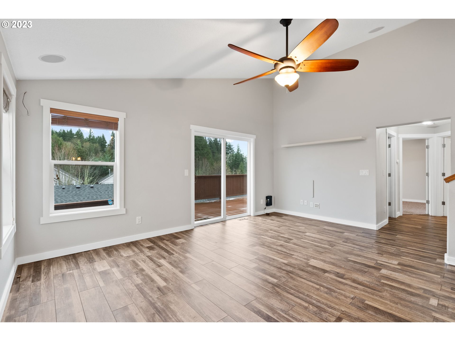 38446 Miller Street Sandy, OR 97055 - Photo 15 of 40 an empty room with wooden floor and windows
