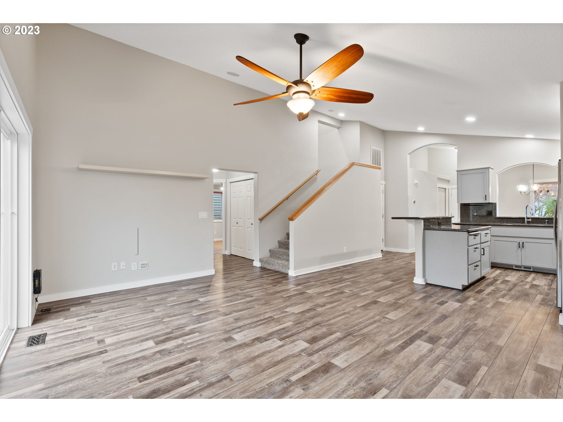 38446 Miller Street Sandy, OR 97055 - Photo 16 of 40 a view of a kitchen with wooden floor and a ceiling fan
