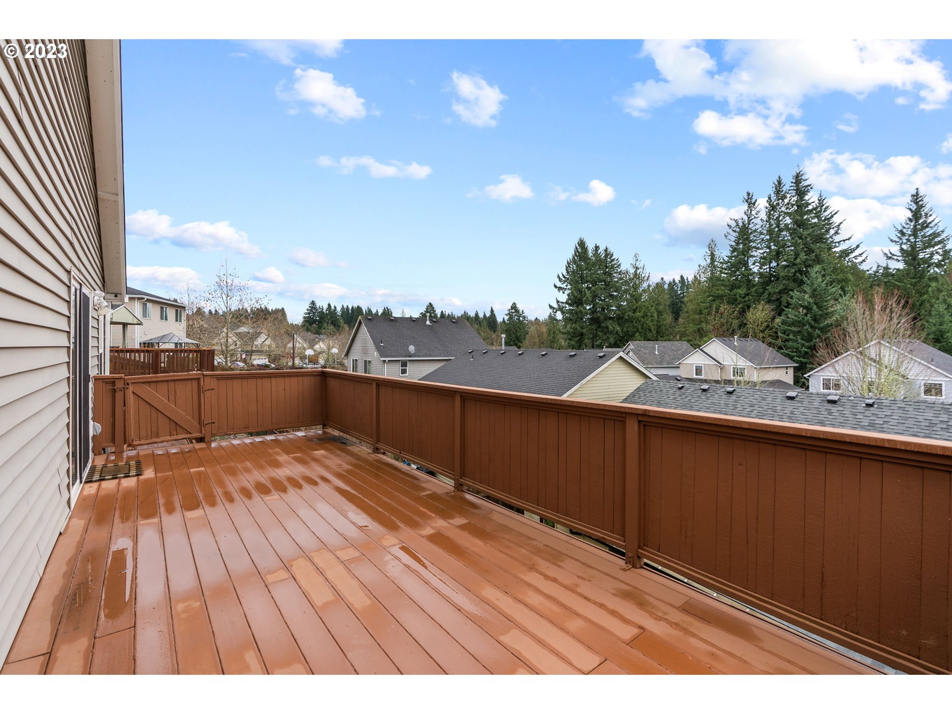 38446 Miller Street Sandy, OR 97055 - Photo 32 of 40 a view of roof deck with wooden floor and fence