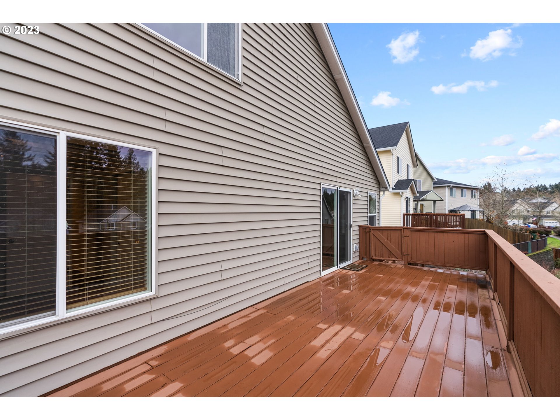 38446 Miller Street Sandy, OR 97055 - Photo 33 of 40 a view of backyard with a balcony and wooden floor
