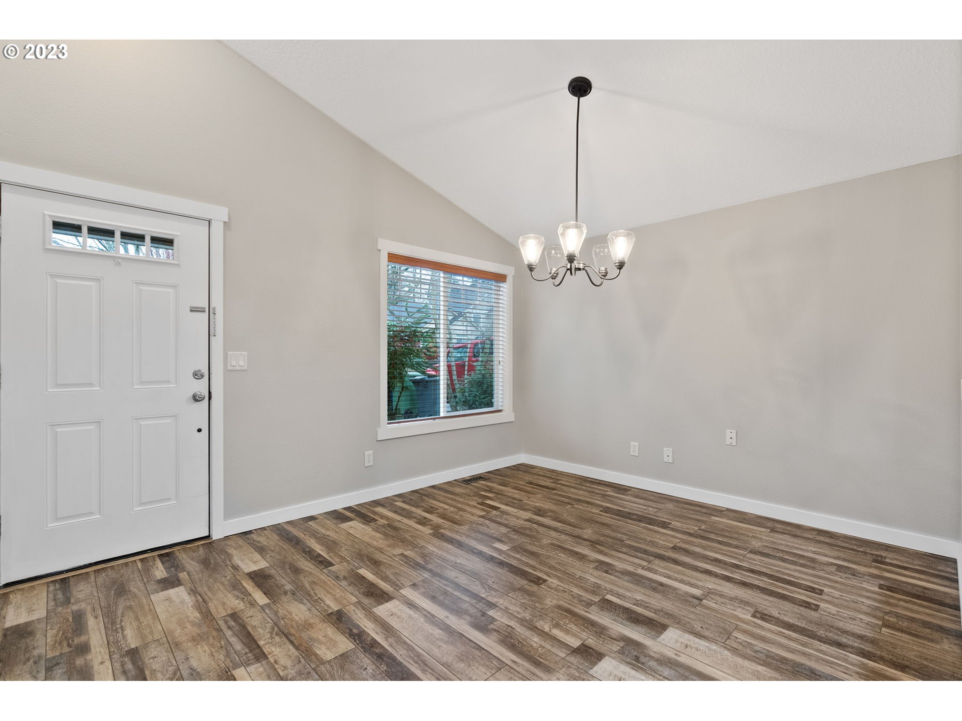 38446 Miller Street Sandy, OR 97055 - Photo 4 of 40 a view of an empty room with window and chandelier fan