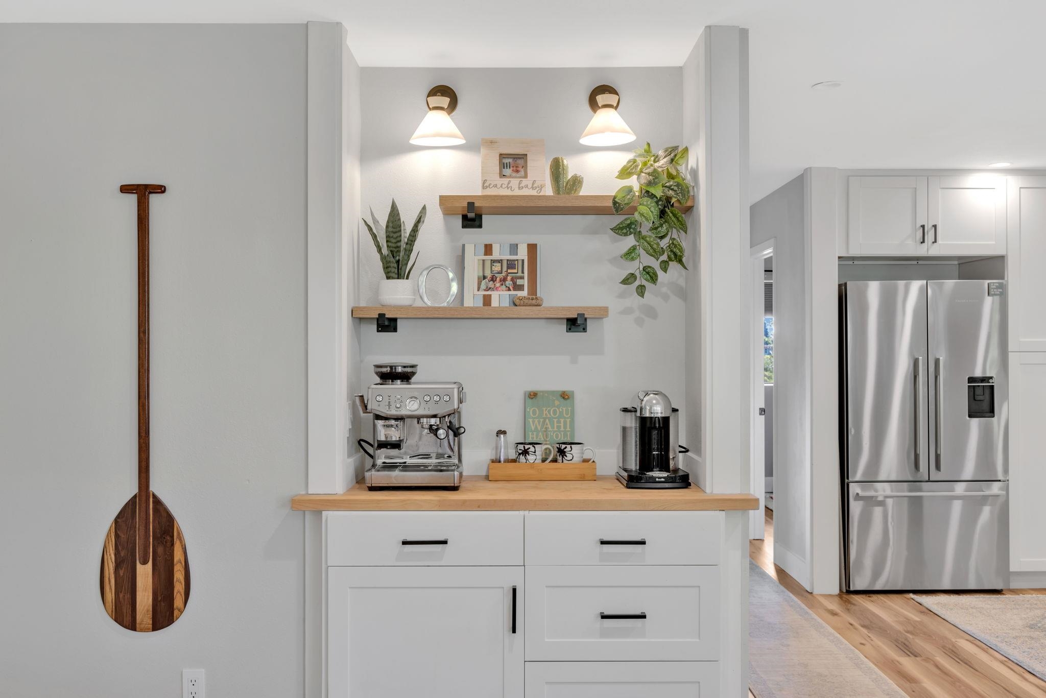 1450 South Kihei Road, Unit C206 Kihei, HI 96753 - Photo 11 of 50 a kitchen with white cabinets and refrigerator