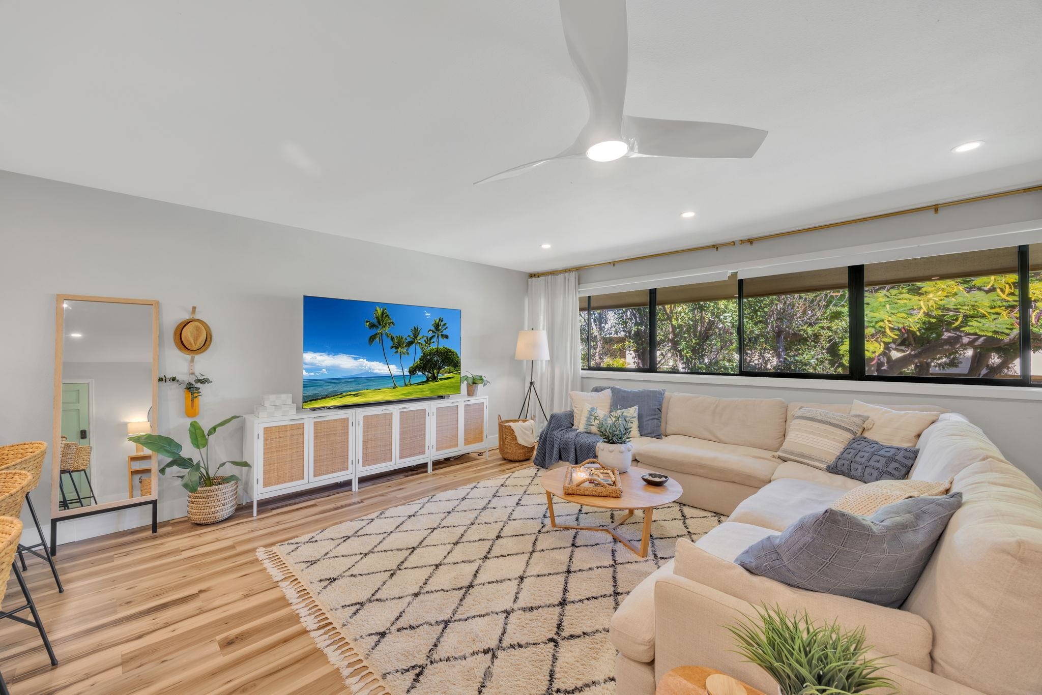 1450 South Kihei Road, Unit C206 Kihei, HI 96753 - Photo 17 of 50 a living room with furniture and a flat screen tv