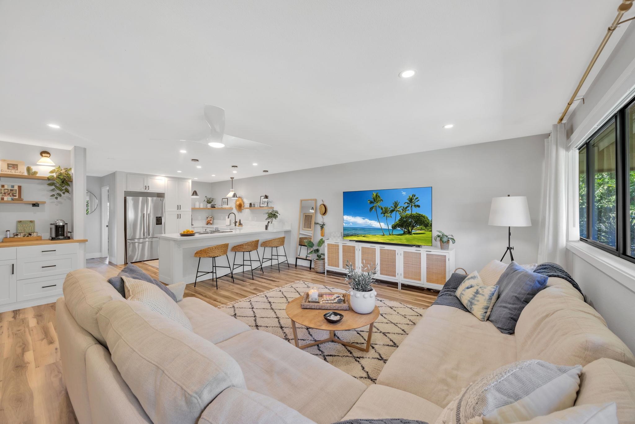 1450 South Kihei Road, Unit C206 Kihei, HI 96753 - Photo 18 of 50 a living room with furniture and a flat screen tv