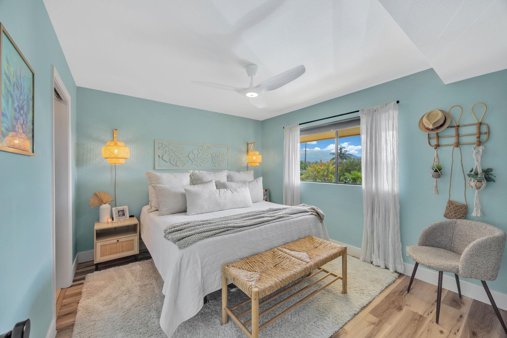 1450 South Kihei Road, Unit C206 Kihei, HI 96753 - Photo 23 of 50 a bedroom with a bed and a chair