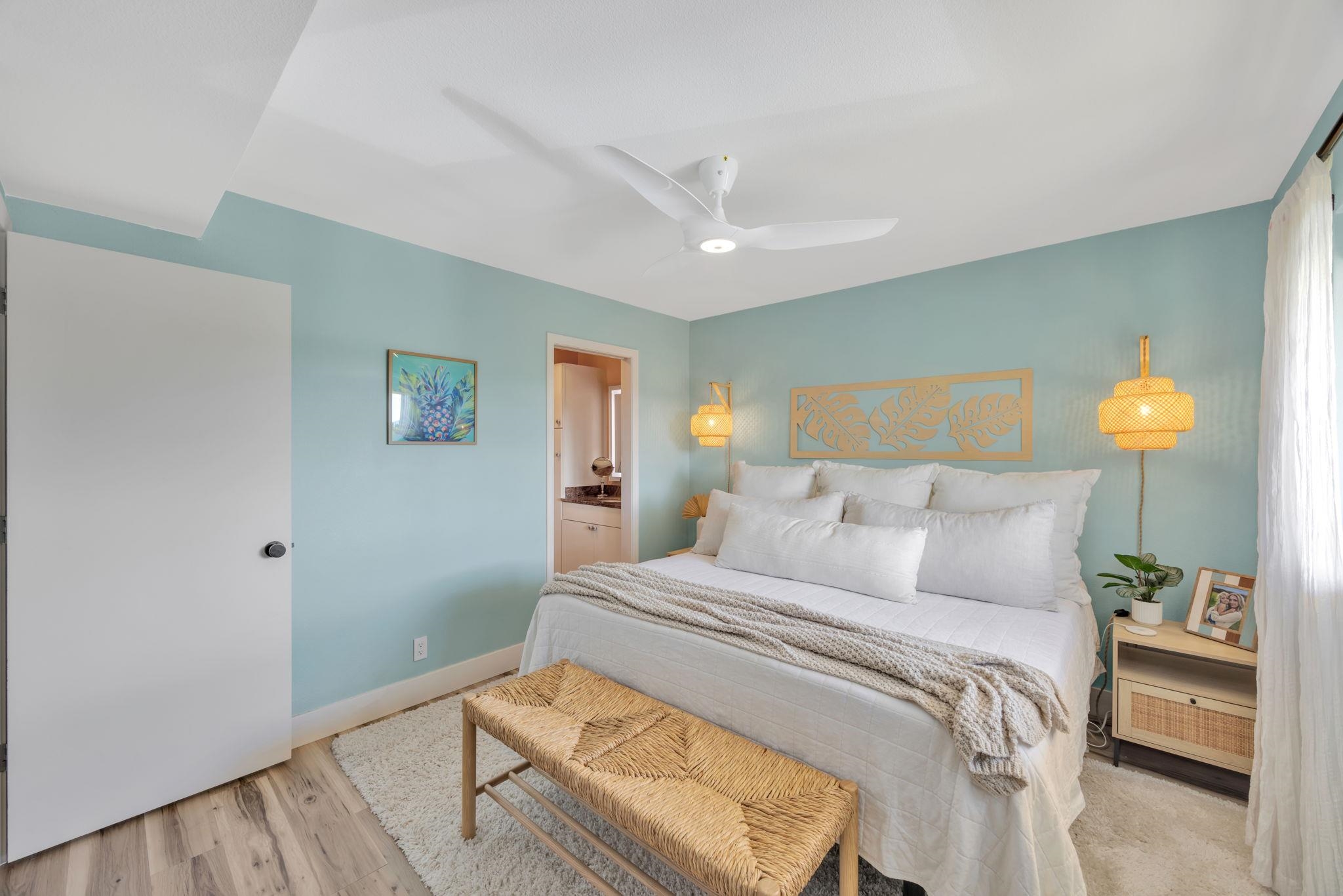 1450 South Kihei Road, Unit C206 Kihei, HI 96753 - Photo 25 of 50 a bedroom with a bed and a lamp