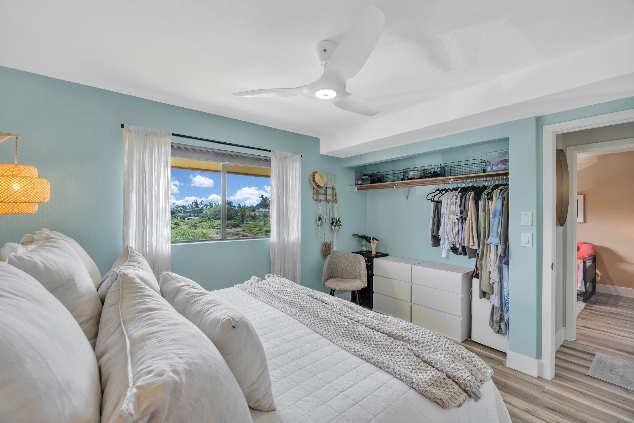 1450 South Kihei Road, Unit C206 Kihei, HI 96753 - Photo 26 of 50 a bedroom with a large bed and a window