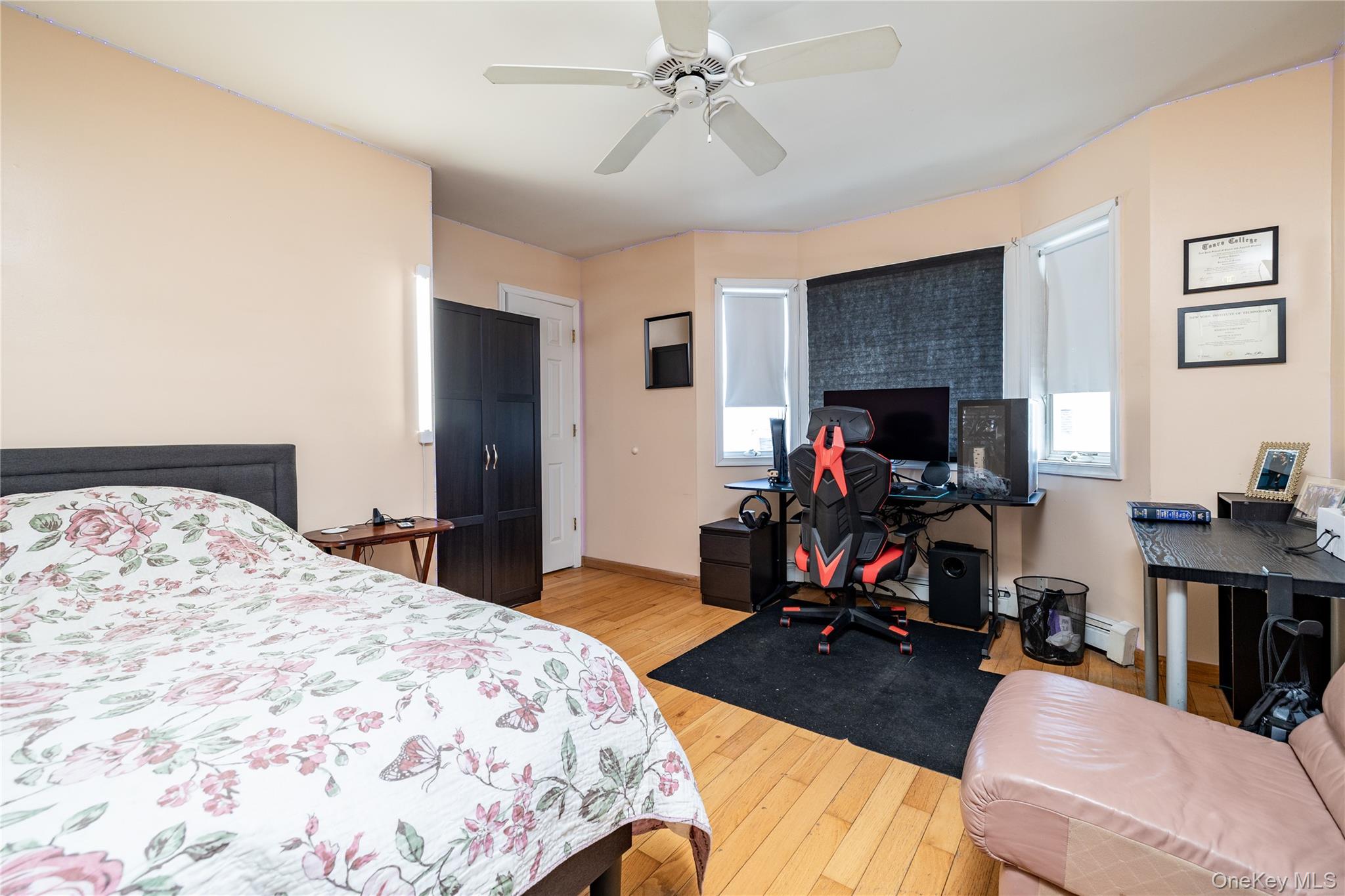 458 East Pine Street Long Beach, NY 11561 - Photo 20 of 26 a bedroom with a bed and a flat screen tv
