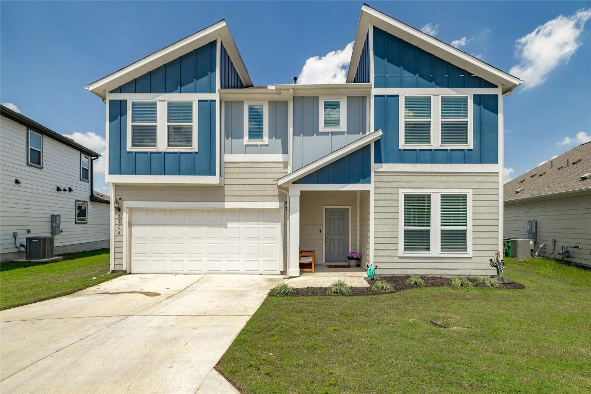 3304 Bratton Crest Lane, Unit 47 Austin, TX 78728 - Photo 1 of 1 a front view of a house with a yard