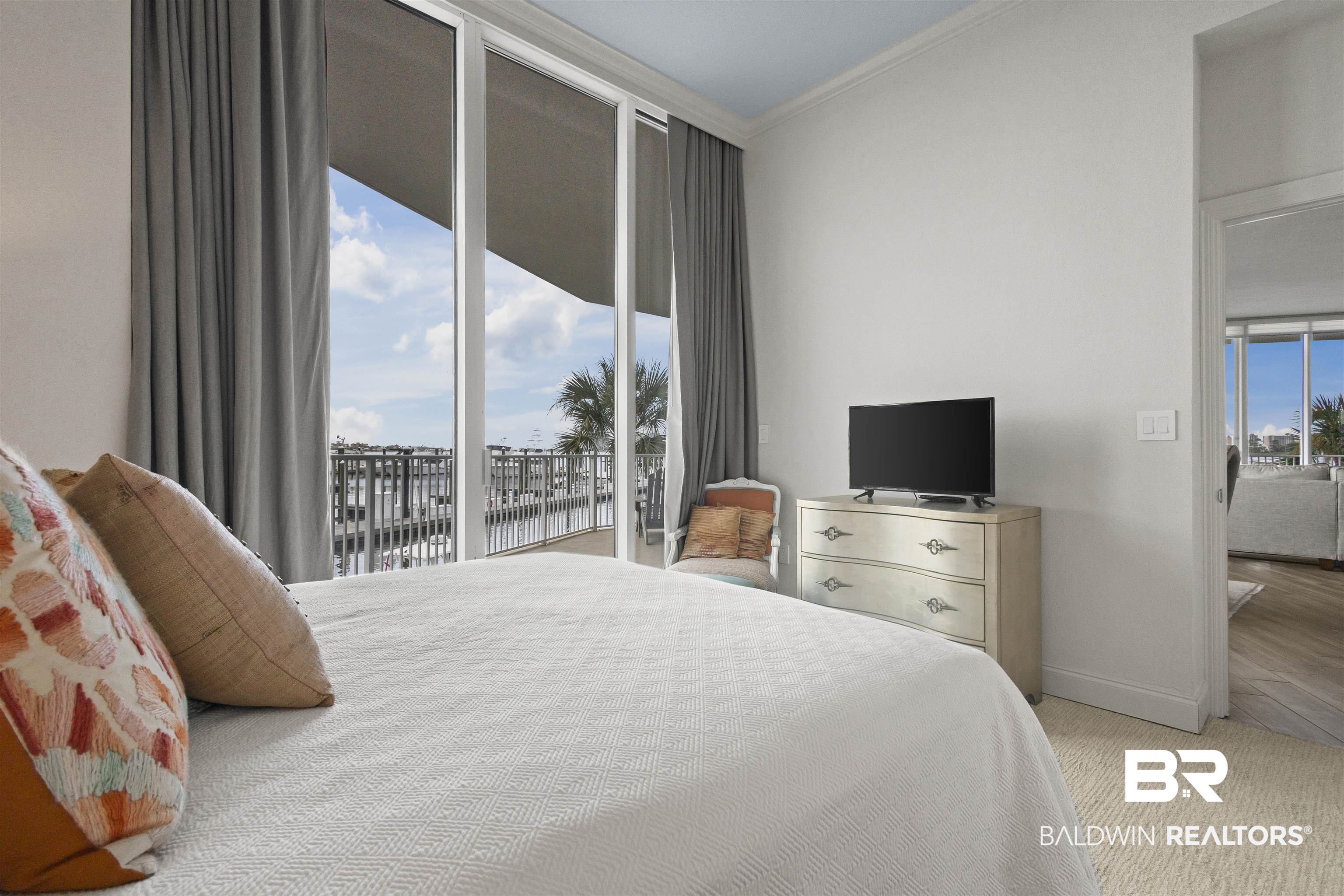 27800 Canal Road, Unit 120 Orange Beach, AL 36561 - Photo 26 of 68 Bedroom with crown molding and access to outside