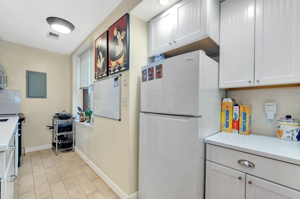 33 Brainerd Road, Unit 311 Boston, MA 02134 - Photo 13 of 18 a white refrigerator freezer sitting in a kitchen